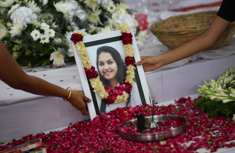 A portrait of Tarishi Jain, a victim of the attack on Dhaka's Holey Artisan Bakery, is laid out for people to pay respect during a memorial service before her cremation in Gurgaon on Monday. Express photo by Oinam Anand. 04 July 2016