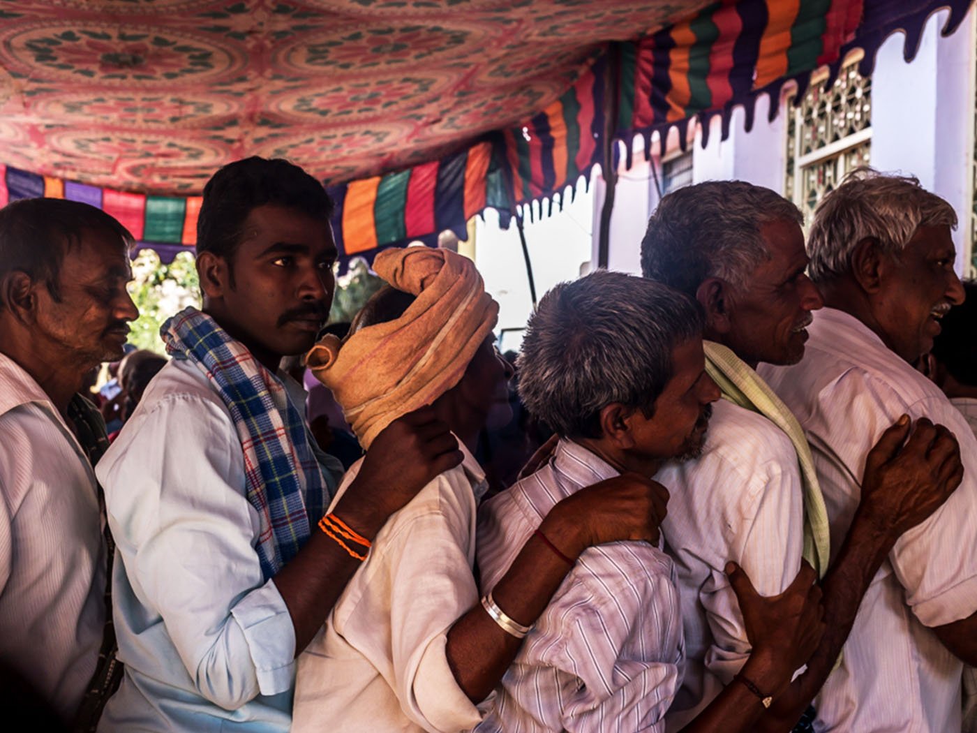 Farmers outside one of the banks in Tadimarri mandal: Farmers like T. Brahmananda Reddy need bulk amounts of the new notes to pay their debts and labourers – and these notes remain scarce at the banks here
