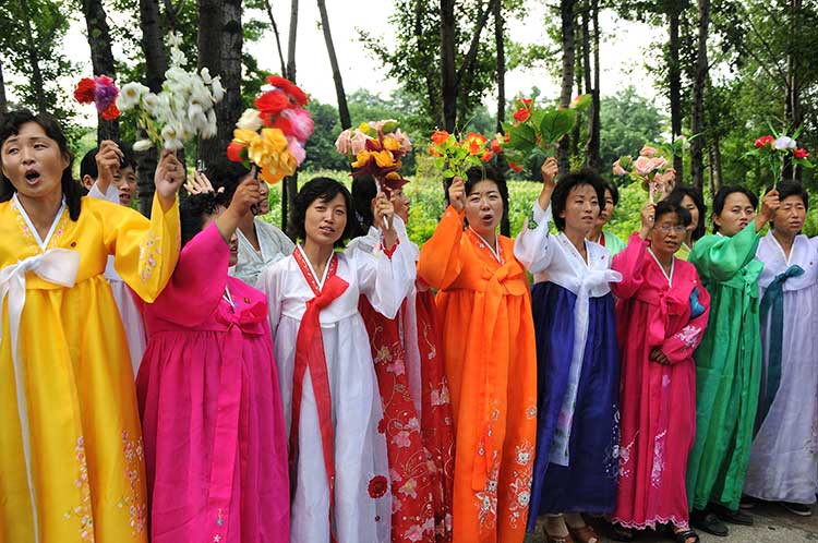 countryside women greeting your correspondent and other delegates