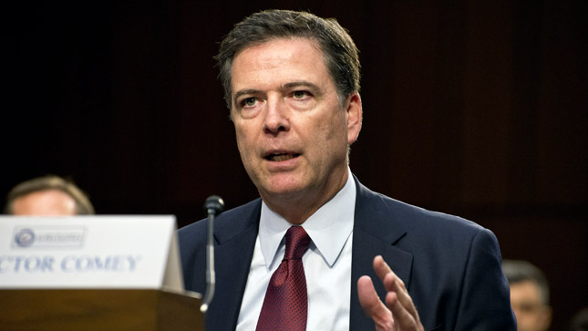 James Comey, the director of the Federal Bureau of Investigation, arrives to testify before the Senate Intelligence Select Committee during an open hearing.