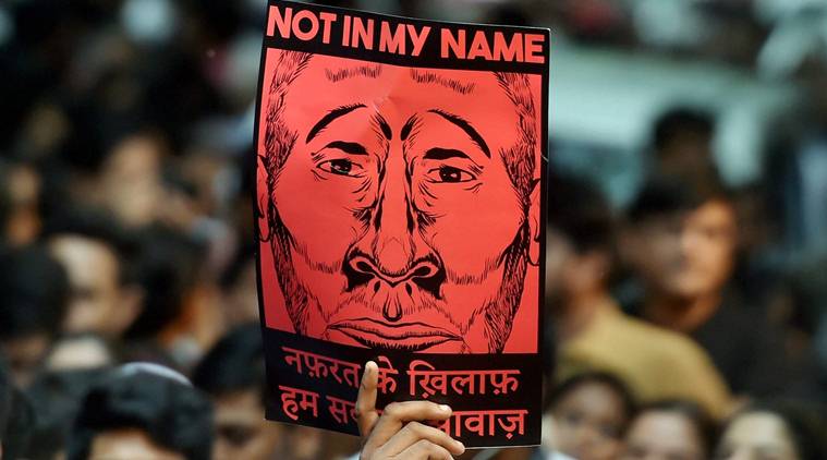 New Delhi : A participant shows a placard during a silent protest "Not in My Name" against the targeted lynching, at Jantar Mantar in New Delhi on Wednesday. PTI Photo by Shahbaz Khan(PTI6_28_2017_000215B)