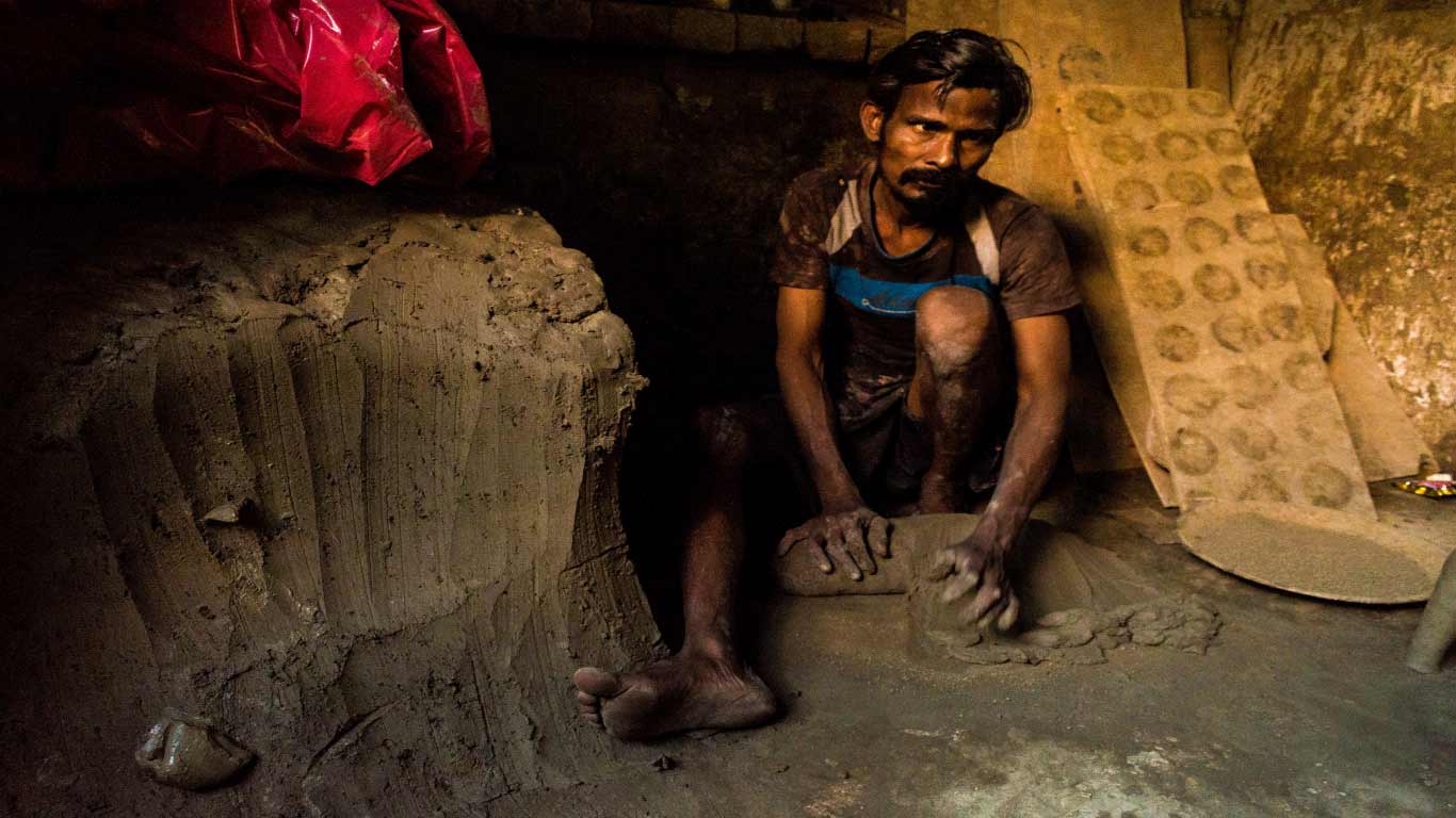 The potters sit round the clock kneading the clay mostly in dingy kutcha mud houses.