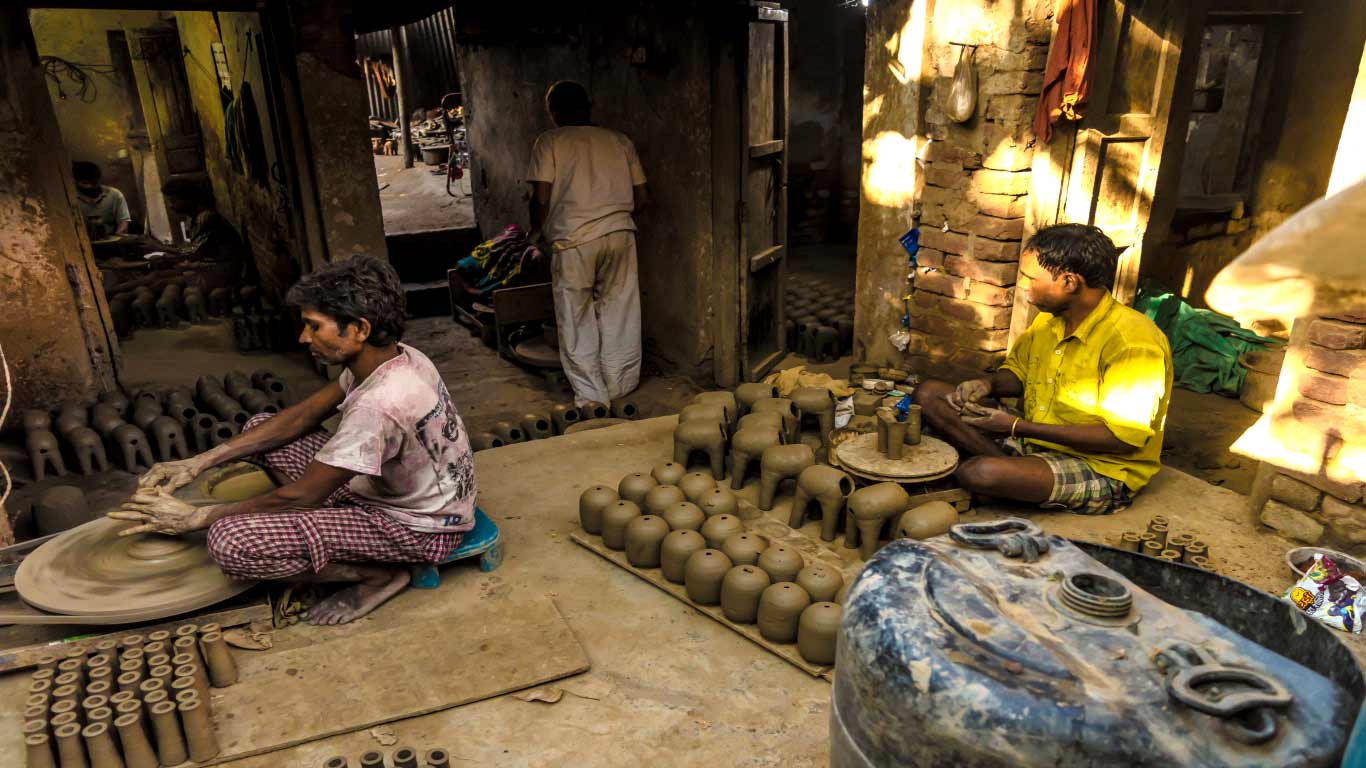 A dingy, conjested workshop which produces around 300-400 pieces a day. Each piece sells for a ballpark figure of Rs 30 in the market.