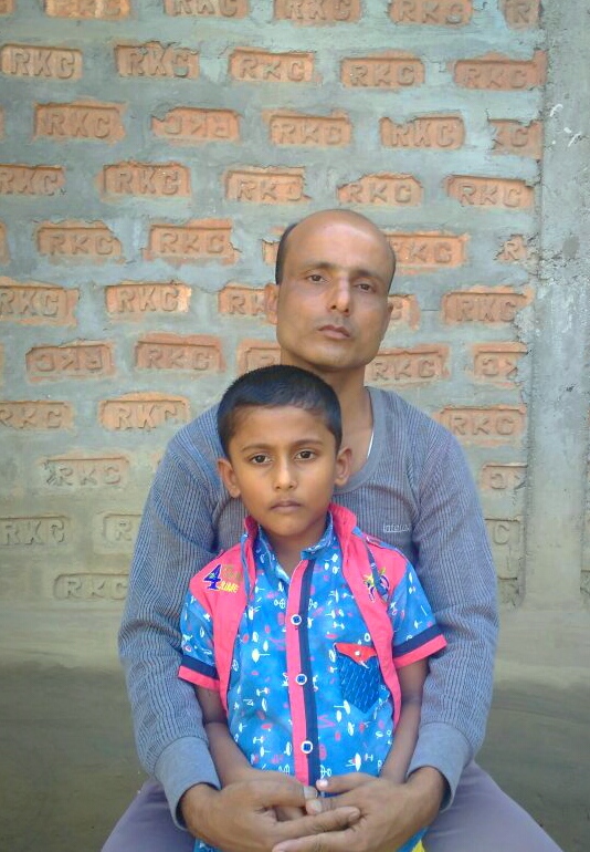 Kismat Ali with his son at his residence in 1 No. Sonjauli village of Dimakuchi in Udalguri of Assam on Thursday.