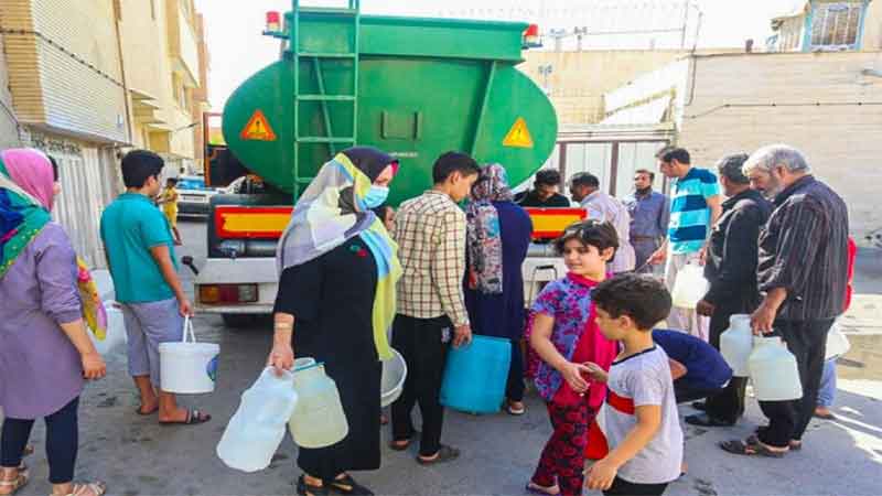 Water rationing in Tehran: People gather to fill containers as supplies dwindle
