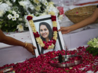 A portrait of Tarishi Jain, a victim of the attack on Dhaka's Holey Artisan Bakery, is laid out for people to pay respect during a memorial service before her cremation in Gurgaon on Monday. Express photo by Oinam Anand. 04 July 2016