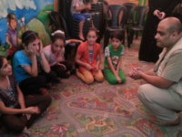 Mohammed El Halabi, World Vision's Area Development Programme Manager in Gaza, meets with children displaced by the violence during the brief ceasefire. Photo by Mohammad Awed