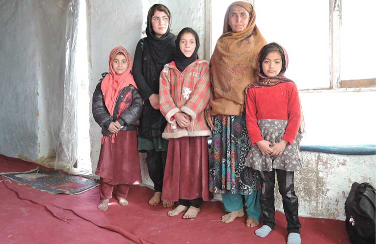 mothers and children inside a Kabul refugee camp Photo credit: Henrietta Cullinan