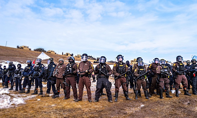 Riot police at the Oceti Sakowin Camp. Photo by Rob Wilson.