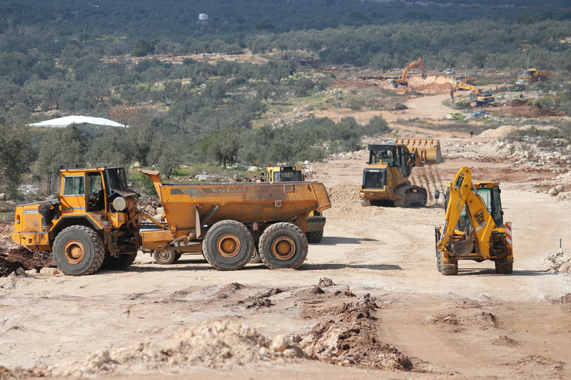 sraeli bulldozers work on a new Israeli settler road, in Nabi Elias village, in the occupied West Bank, on 6 February. Some 700 olive trees were uprooted from private Palestinian land to build the road. Ahmad Al-Bazz ActiveStills