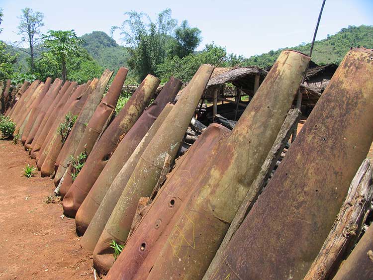 Laos Plain of Jars - village fence made of American bombs