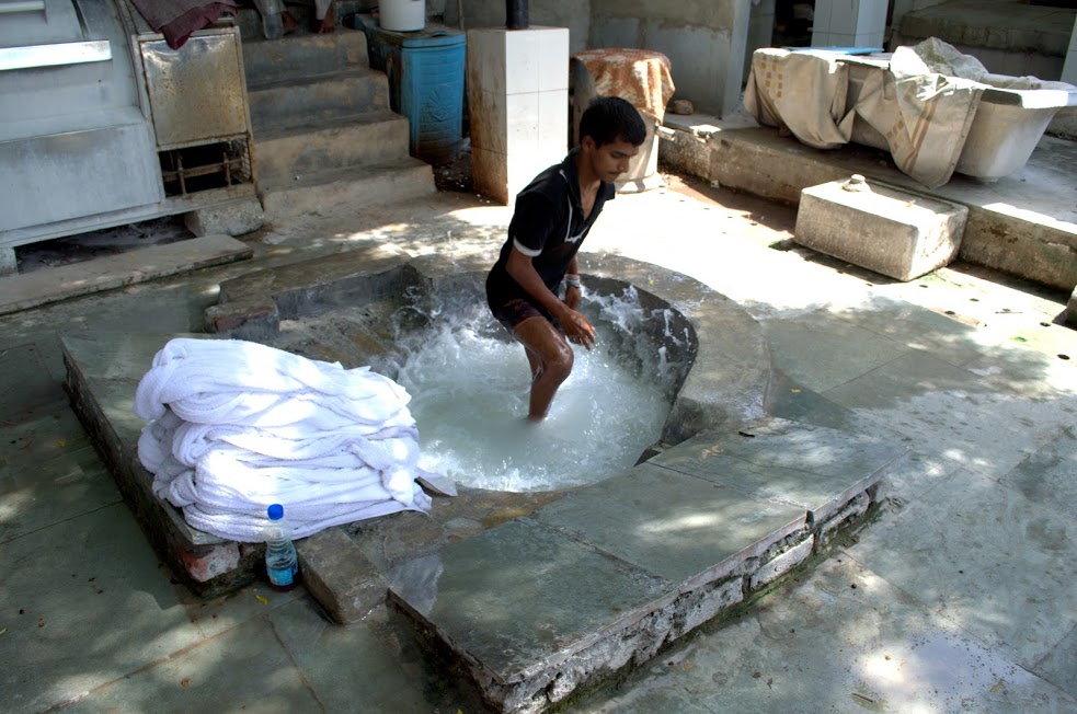 In the absence of a nearby river, washermen at this ghat use cement tubs to wash clothes.