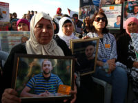 Palestinian mothers take part in a rally with hunger striking prisoners in the West Bank city of Ramallah on 3 May. Ahmad Al-Bazz ActiveStills