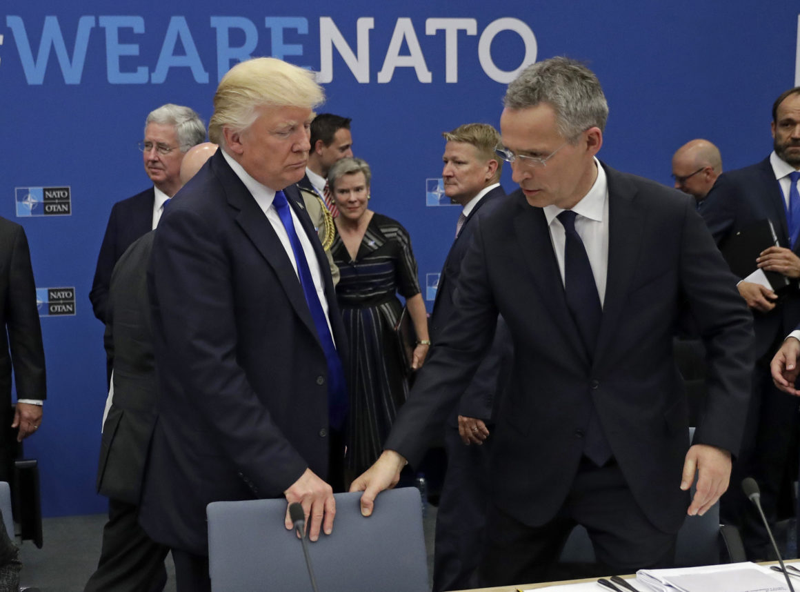 epa05990111 US President Donald J. Trump (L) and NATO Secretary General Jens Stoltenberg (R) grab for a seat during a working dinner meeting at the NATO summit in Brussels, Belgium, 25 May 2017. NATO countries' heads of states and governments gather in Brussels for a one-day meeting.  EPA/Matt Dunham / POOL