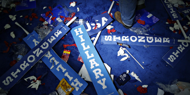 A worker walks past a "Hillary" sign on the floor after the Democratic National Convention (DNC) in Philadelphia, Pennsylvania, U.S., on Thursday, July 28, 2016. Division among Democrats has been overcome through speeches from two presidents, another first lady and a vice-president, who raised the stakes for their candidate by warning that her opponent posed an unprecedented threat to American diplomacy. Photographer: Andrew Harrer/Bloomberg via Getty Images