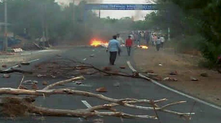 Mandsaur: A scene after violent clashes between farmers and the police at Pipliya in Mandsaur district on Tuesday. At least five farmers were killed and four others injured in firing by police on farmers, who have been protesting for a week demanding loan waiver and fair price for their produce. PTI Photo (PTI6_6_2017_000193B)