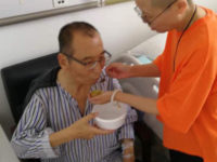 In this undated photo, Liu Xia feeds her husband Liu Xiaobo at a hospital in China.