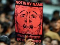 New Delhi : A participant shows a placard during a silent protest "Not in My Name" against the targeted lynching, at Jantar Mantar in New Delhi on Wednesday. PTI Photo by Shahbaz Khan(PTI6_28_2017_000215B)