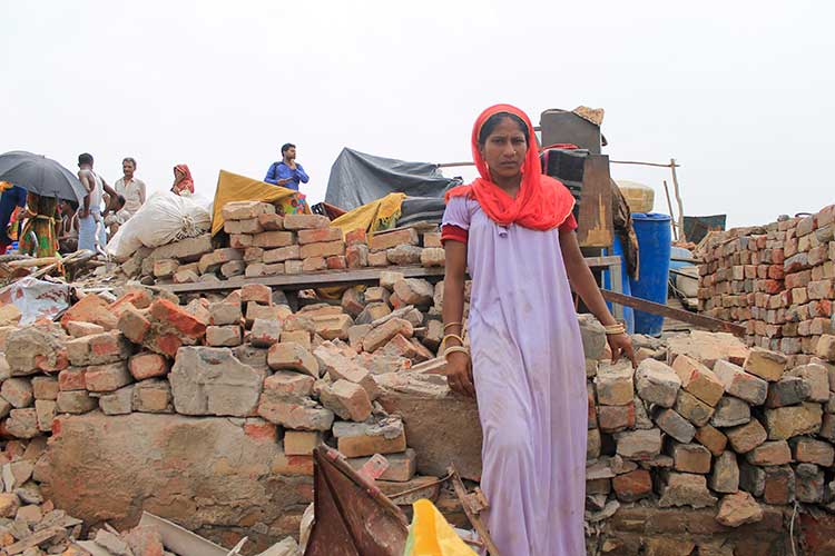 Ruchi Devi (Name Changed), the resident of Gulshan chowk slum shows her demolished house