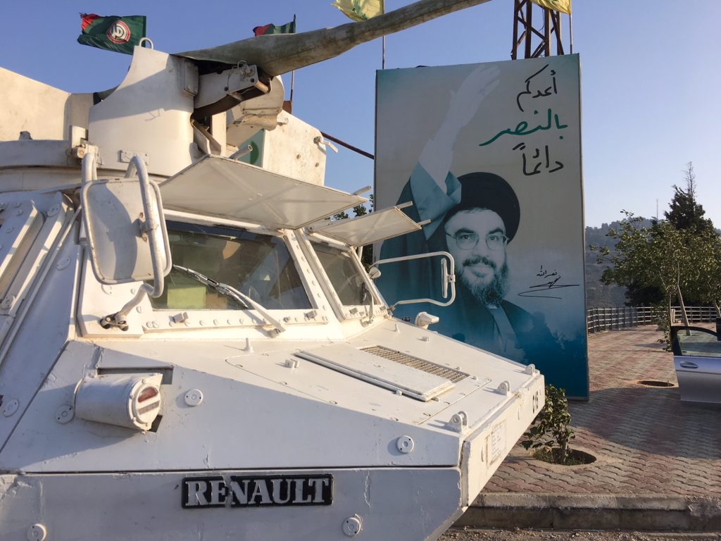 On Lebanon Israeli border UN armored vehicle and Nasrallah