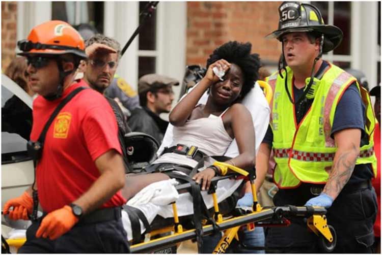 Evacuating one of the Charlotteville, VA  car crash victims