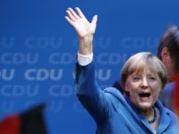 German Chancellor and leader of the Christian Democratic Union (CDU) Angela Merkel waves to supporters as she celebrates with party members after first exit polls in the German general election (Bundestagswahl) at the CDU party headquarters in Berlin September 22, 2013. Chancellor Angela Merkel won a landslide personal victory in a German election on Sunday, putting her within reach of the first absolute majority in parliament in half a century, a ringing endorsement of her steady leadership in the euro crisis.                REUTERS/Fabrizio Bensch (GERMANY  - Tags: POLITICS ELECTIONS)