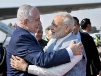 New Delhi:  Prime Minister Narendra Modi welcomes Israeli Prime Minister Benjamin Netanyahu on his arrival at Air Force Station, Palam, in New Delhi on Sunday. PTI Photo / PIB(PTI1_14_2018_000094B)