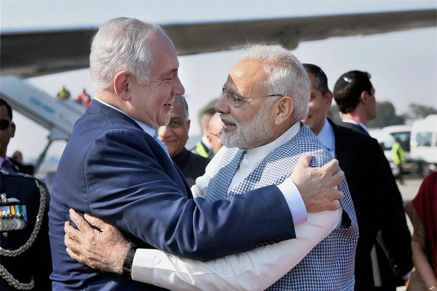 New Delhi: Prime Minister Narendra Modi welcomes Israeli Prime Minister Benjamin Netanyahu on his arrival at Air Force Station, Palam, in New Delhi on Sunday. PTI Photo / PIB(PTI1_14_2018_000094B)