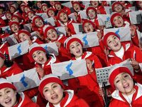 [Photo:  North Korean cheerleaders wave unification flags during Team Korea's ice hockey game against Sweden at the Gwandong Ice Hockey Center in Gangneung, Monday. / Yonhap, Korean Times http://www.koreatimes.co.kr/www/sports/2018/02/702_244132.html ]