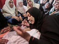 Ismail Abu Riyala’s mother Kifa mourns during her son’s funeral on 15 March. Abu Riyala was killed by the Israeli navy on 25 February. Mohammed Asad