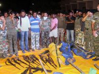 Gadchiroli: Security personnel show the guns recoverd from the Naxals killed in an encounter at Broriya forest area in Bhamragad taluka of Gadchiroli dustrict of Maharashtra on Sunday night. PTI Photo  (PTI4_23_2018_000069B)