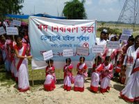 Childrens holding placards on the awareness programme at Beluguri village in Orang of Udalguri of Assam on Sunday.