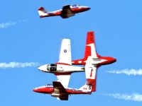 t092212 --- Clint Austin --- austinAIR0924c1 --- The Canadian Snowbirds perform a four plance cross manoeuver during thier performance at the Duluth Airshow Saturday afternoon. (Clint Austin / caustin@duluthnews.com)