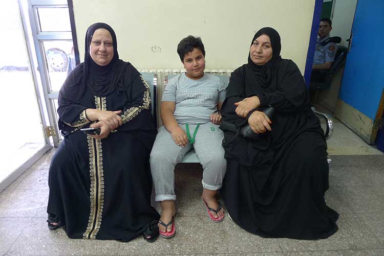 Syrian ladies and a child refugees