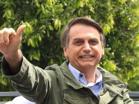 RIO DE JANEIRO, BRAZIL - OCTOBER 28: Jair Bolsonaro, far-right lawmaker and presidential candidate of the Social Liberal Party (PSL), gestures after casting his vote during general elections on October 28, 2018 in Rio de Janeiro, Brazil.  (Photo by Buda Mendes/Getty Images)