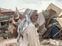 Omar Arif Bisharat stands in front of the rubble of his home in al-Hadidiya. Annelies Verbeek