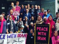 With the author kneeling in the lower right, an international peace delegation outside Iran's Tehran Peace Museum. (Photo: Courtesy of Medea Benjamin)