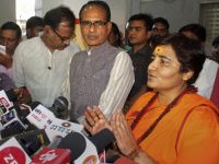 Bhopal: BJP candidate for Bhopal Lok Sabha seat Sadhvi Pragya Singh Thakur, with BJP vice president Shivraj Singh Chouhan, addresses a press conference at the party's state headquarters in Bhopal, Wednesday, April 17, 2019. BJP has fielded Thakur, an accused in the 2008 Malegaon blasts, as its candidate against Congress leader Digvijay Singh. (PTI Photo)  (PTI4_17_2019_000160B)