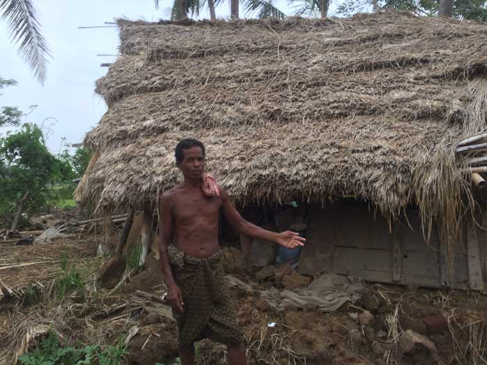 Rabi Bhoi showing his damaged house