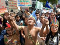 Colombian natives and activists protested against the government of Brazilian President Jair Bolsonaro over the fires in the Amazon rainforest, in front of the Brazilian consulate in Bogota, Colombia, on August 23, 2019.(Raul Arboleda/AFP/Getty Images)