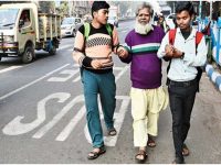 Two Hindu students in Kolkata, India walking a blind Muslim to a Mosque