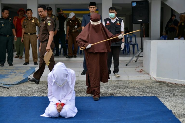 Female flogging squad Aceh