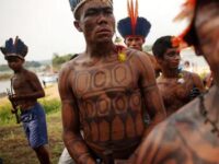 Munduruku people gather along the Tapajós River to protest a proposed dam on Nov. 27, 2014, in Pará, Brazil.