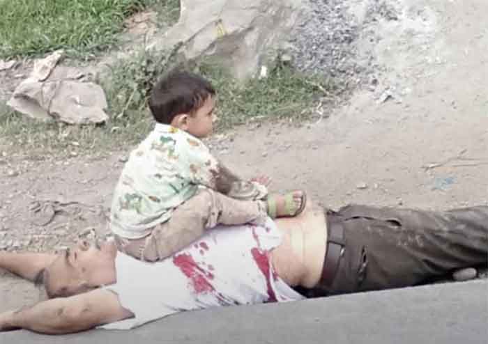 kashmir kid sits on body of grandfather
