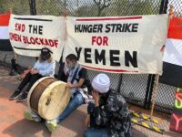 Iman Saleh (with drum) on hunger strike  in Washington D.C. to protest the blockade and war against Yemen; seated next to her is Rep. Ilhan Omar
Photo credit: Hassan El-Tayyab
