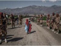 Afghan children walk past a Taliban Red Unit, an elite force, Alingar district, Laghman province in eastern Afghanistan (File photo) 