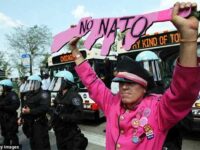 CODEPINK Tighe Barry at NATO protest. Credit: Getty Images