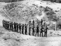In front of the firing squad