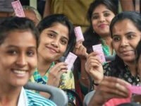 Women in a Delhi bus display their pink tickets. | PTI