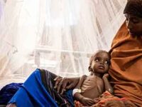 A mother holds her malnourished baby at a hospital in Baidoa, Somalia on September 3, 2022. (Photo: Ed Ram/Getty Images)